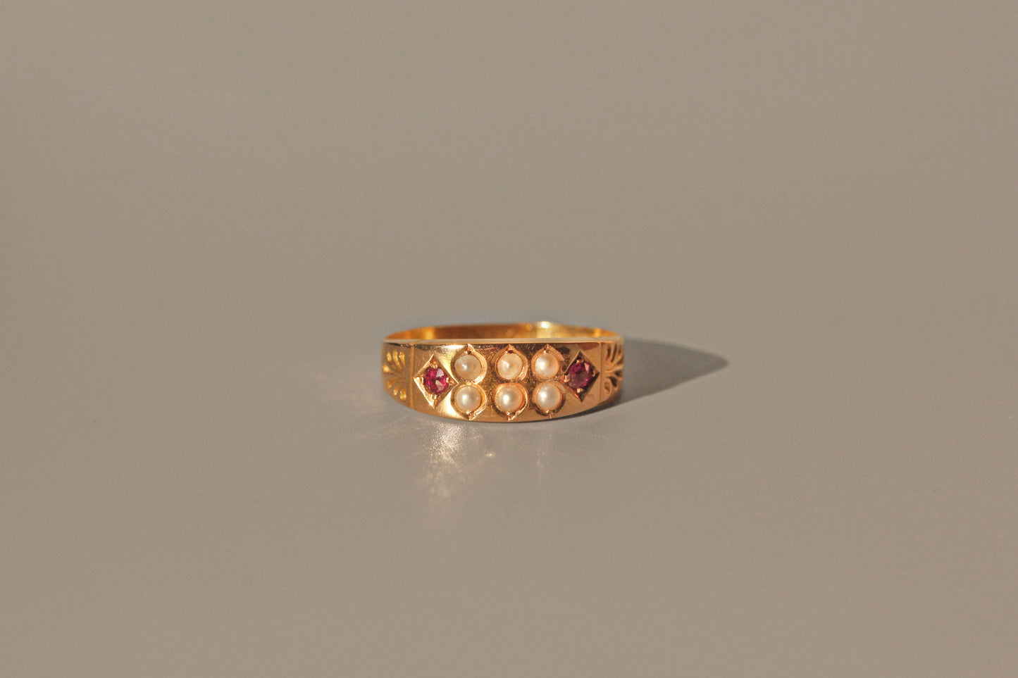Antique victorian ruby & seed pearl band ring, in 15 carat gold
