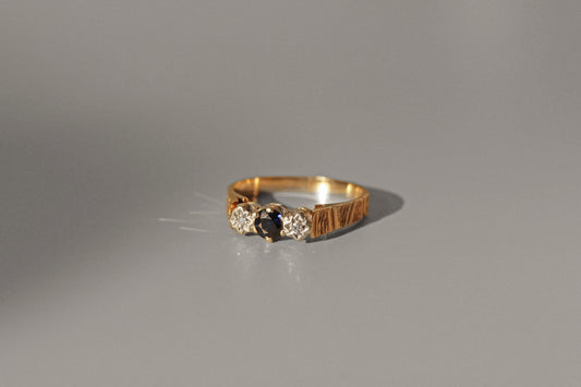 Mid century sapphire and diamond ring with star detailed bezels