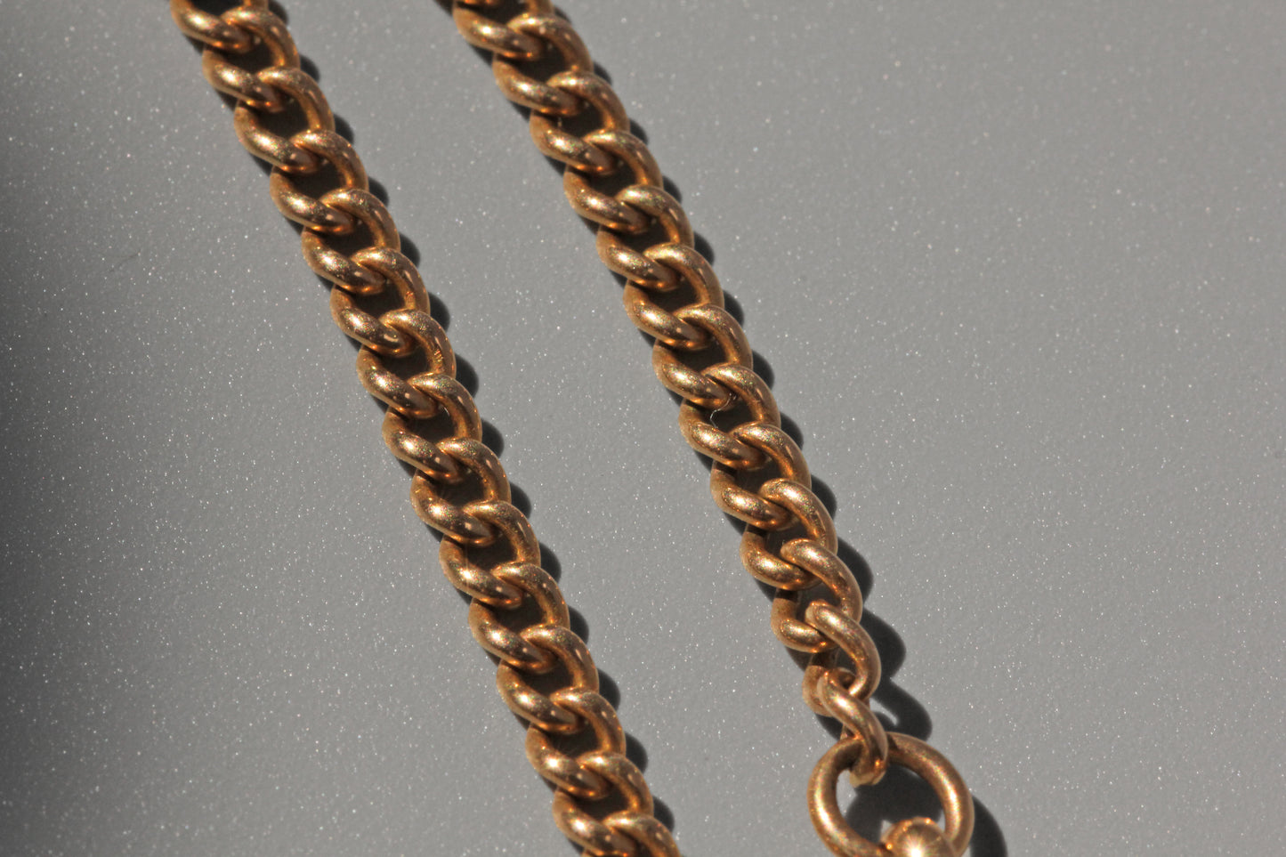 Antique curb link albert chain, in 18 carat gold