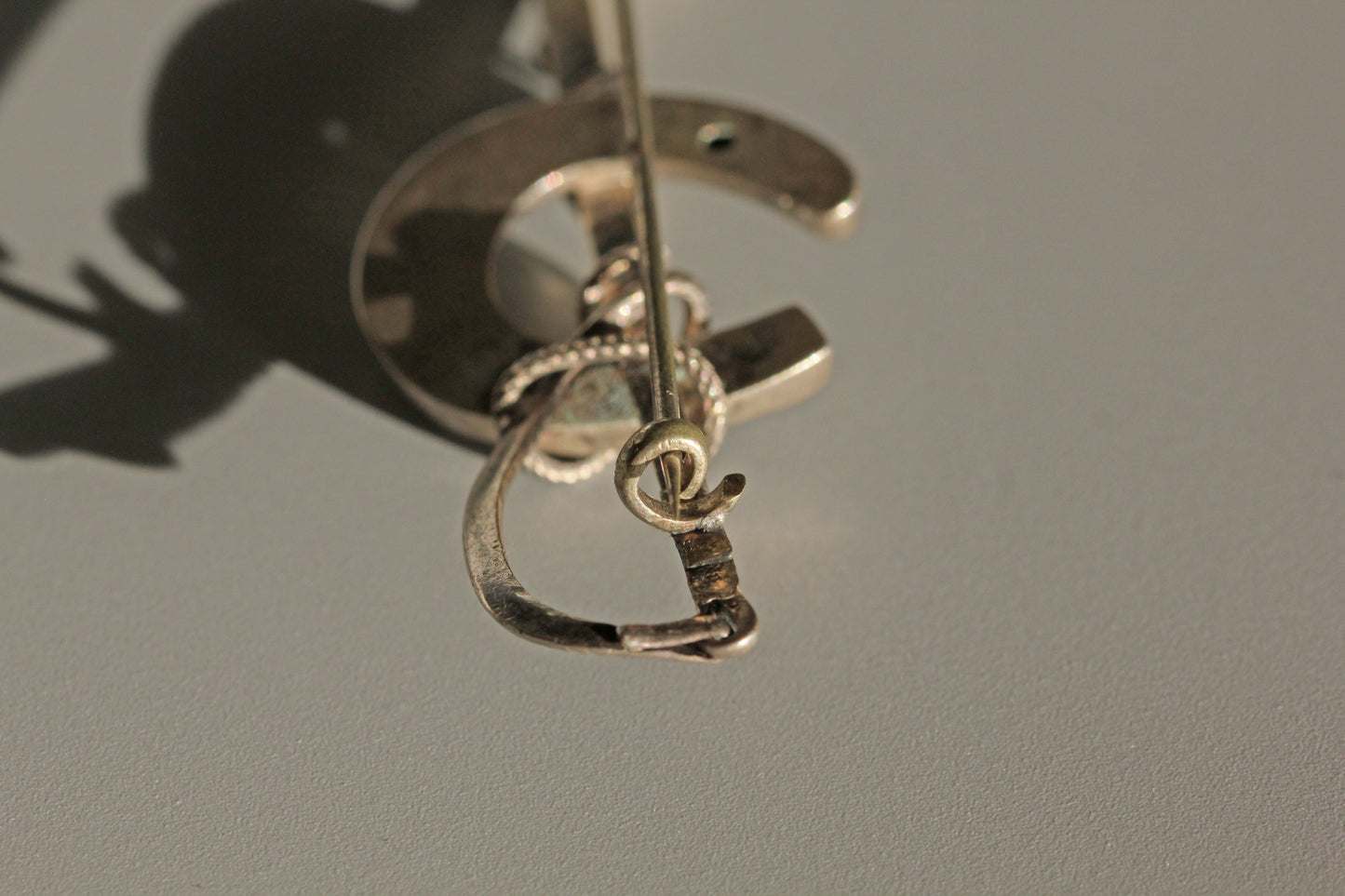 Antique lucky horseshoe riding crop brooch, in sterling silver
