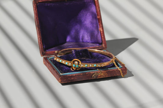 antique gold bangle with clover motif