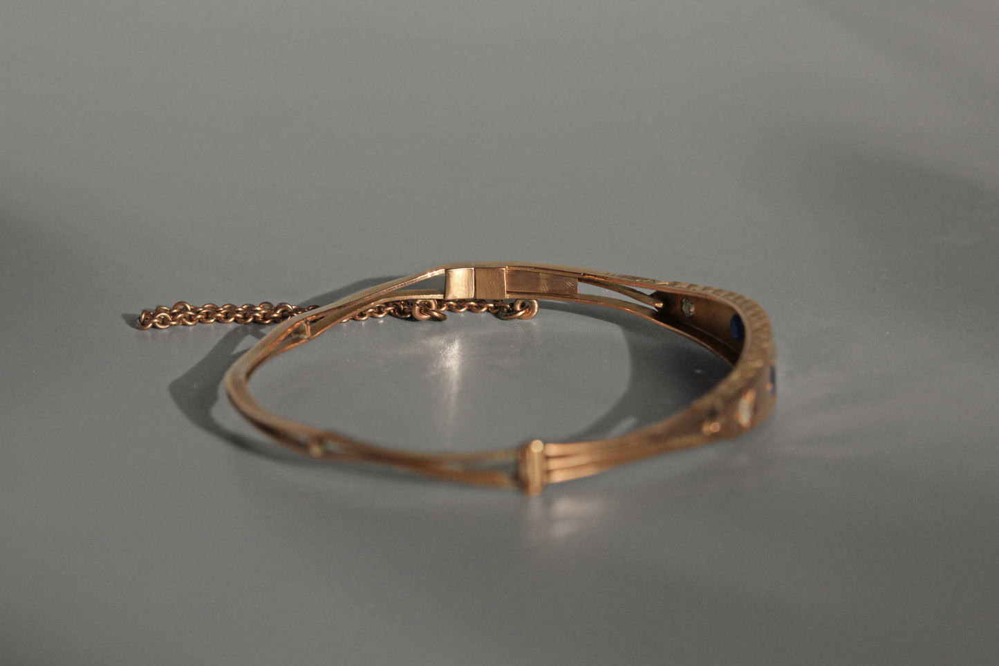 Antique victorian diamond and sapphire bangle, in 9 carat gold
