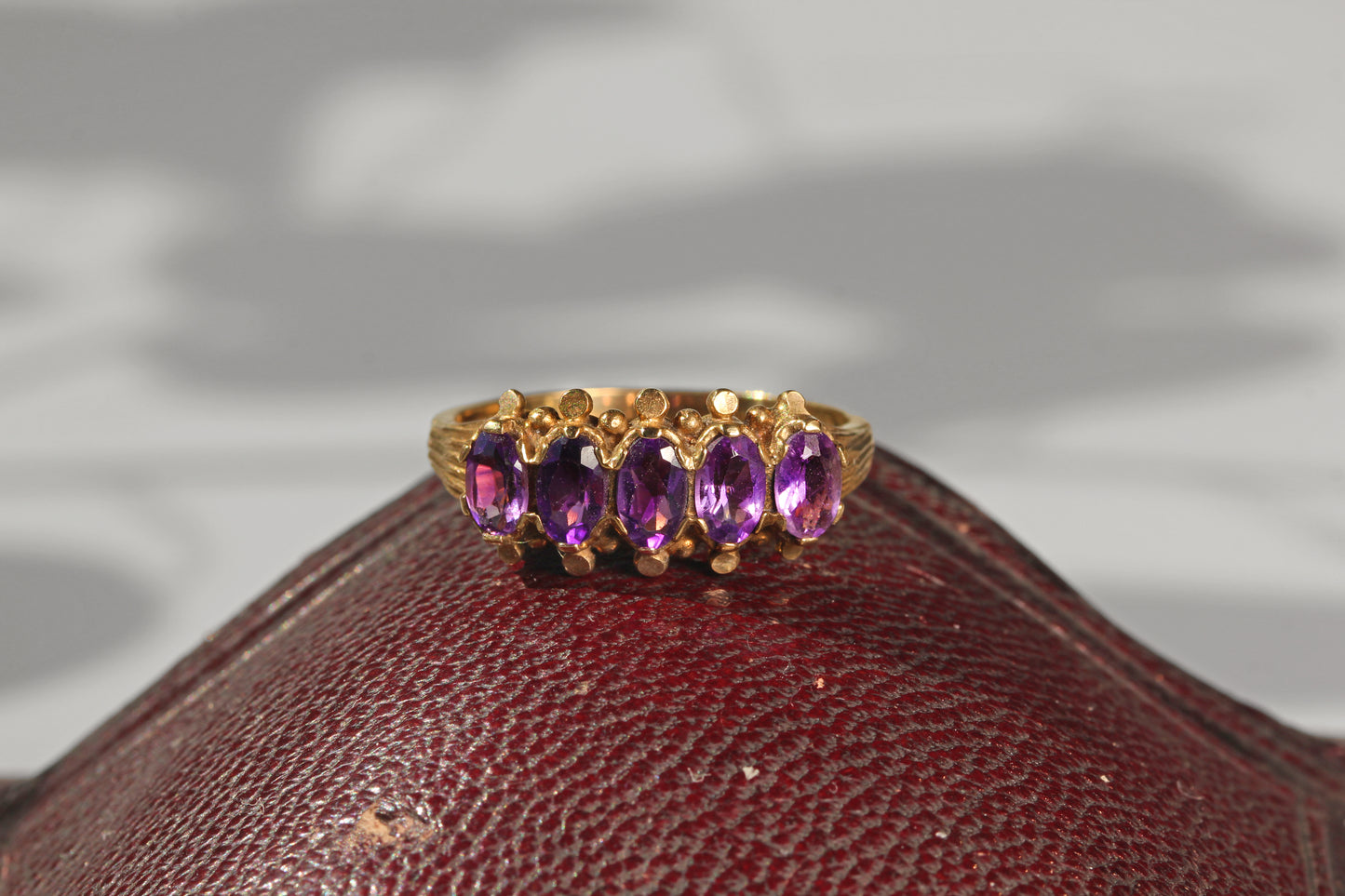 Vintage amethyst five stone ring, in 9 carat gold