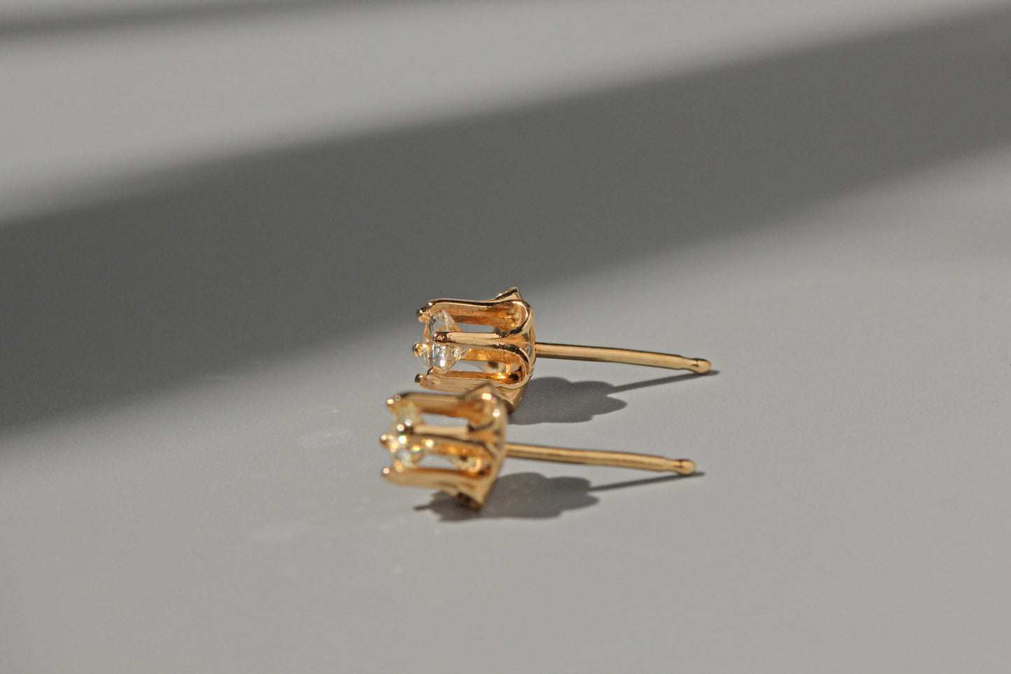 Vintage diamond solitaire buttercup belcher earrings, in 14 carat gold