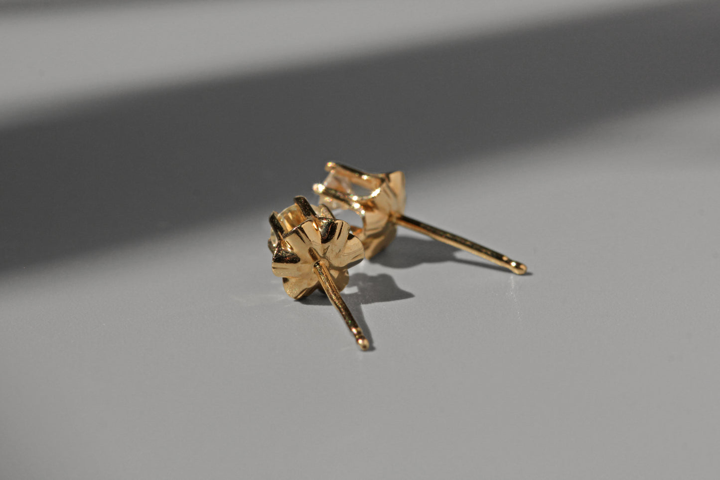 Vintage diamond solitaire buttercup belcher earrings, in 14 carat gold