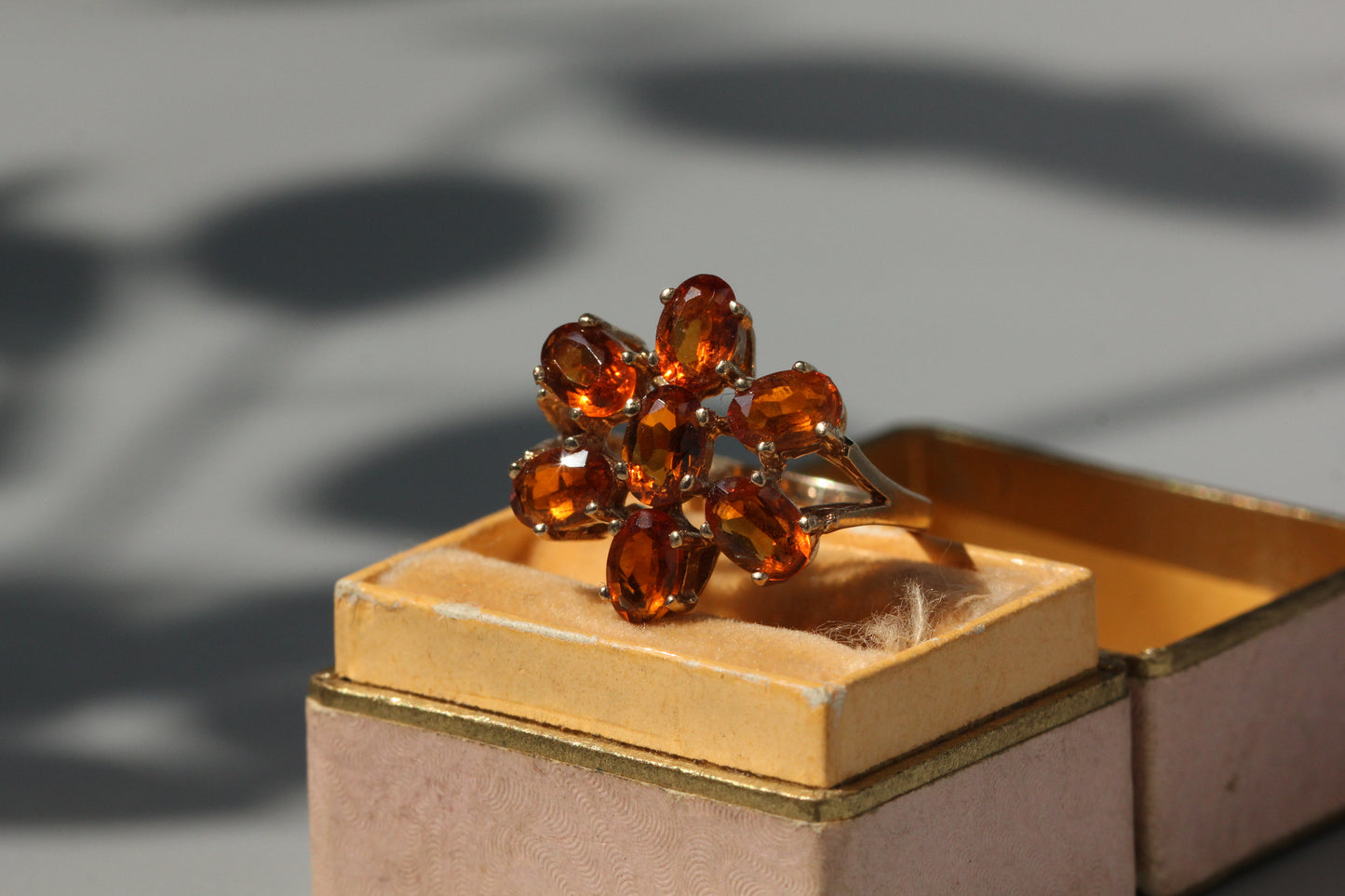 Vintage orange topaz flower cluster ring, in 9 carat gold