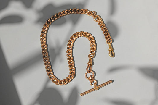 Antique curb link albert chain with tbar, in 9 carat gold