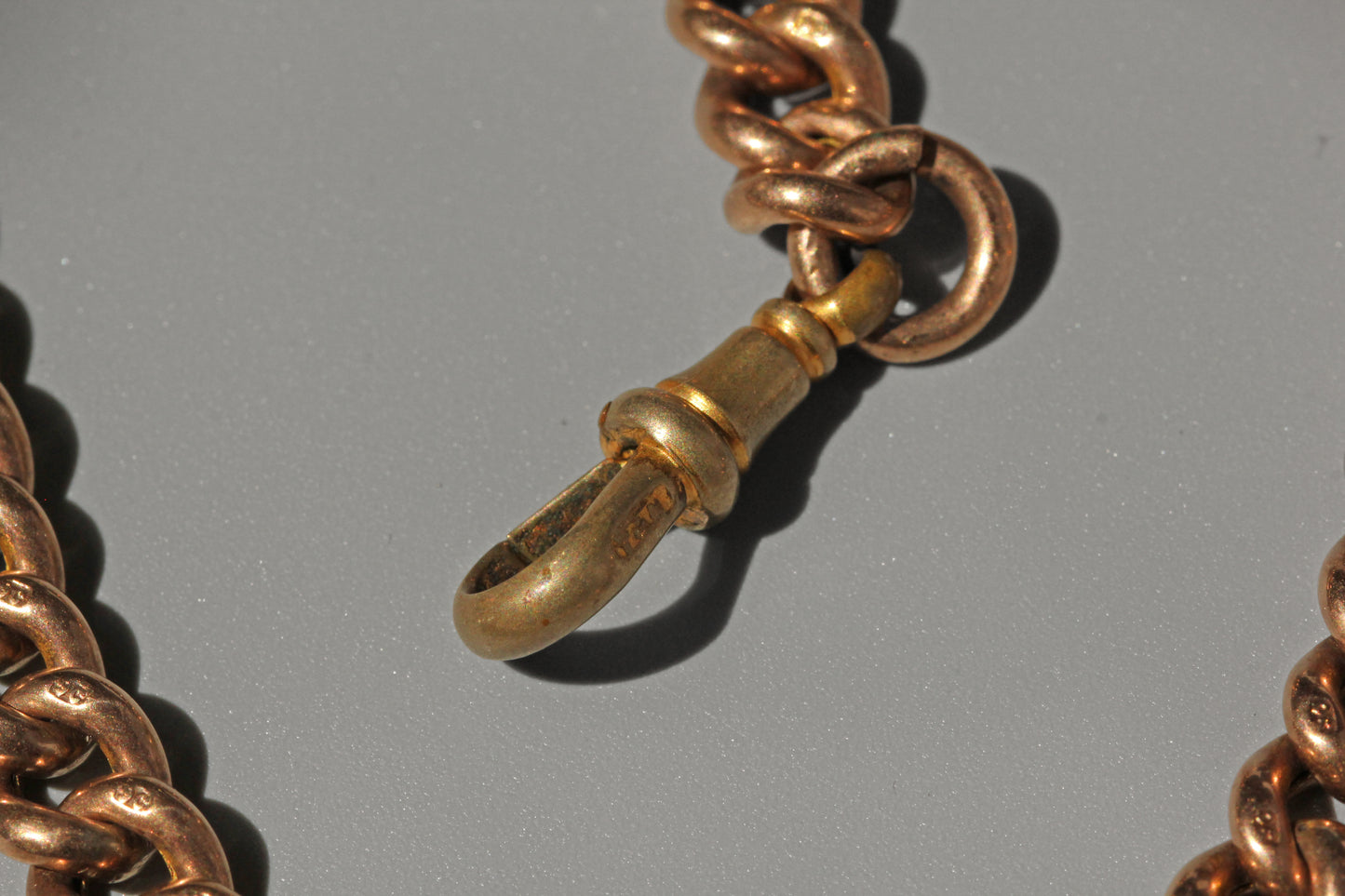 Antique curb link albert chain with tbar, in 9 carat gold