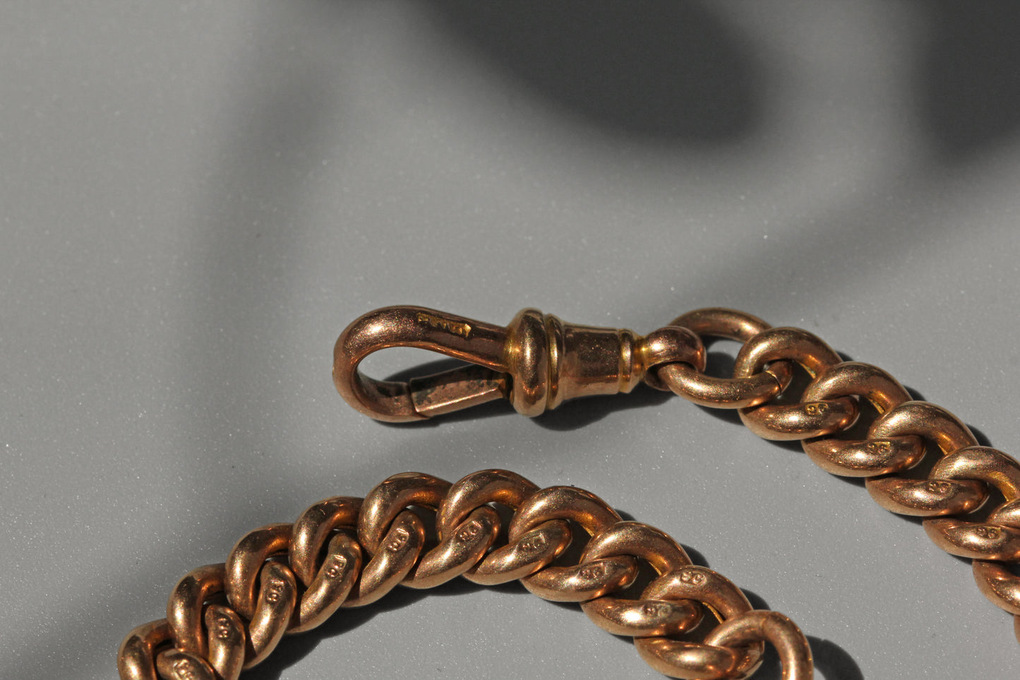 Antique curb link albert chain with tbar, in 9 carat gold