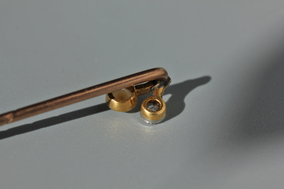 Antique old cut diamond and pearl toi et moi stick pin, in 18ct gold