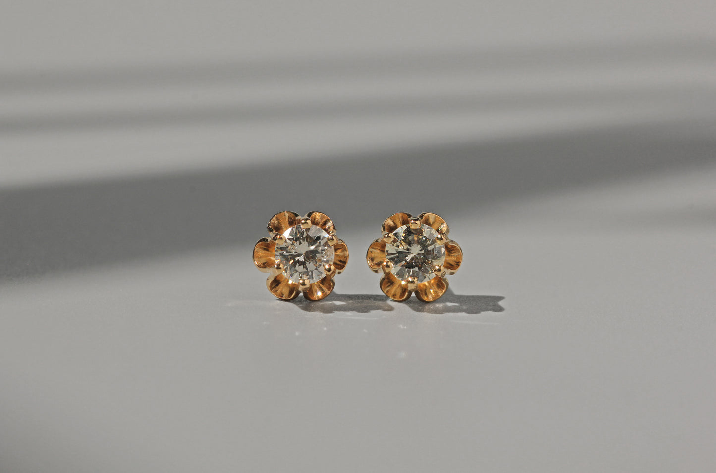 Vintage diamond solitaire buttercup belcher earrings, in 14 carat gold