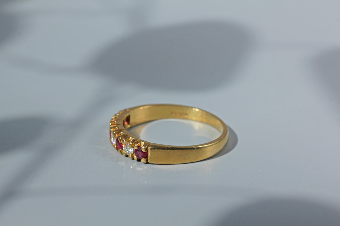 Side view of vintage 18ct gold ruby and diamond ring