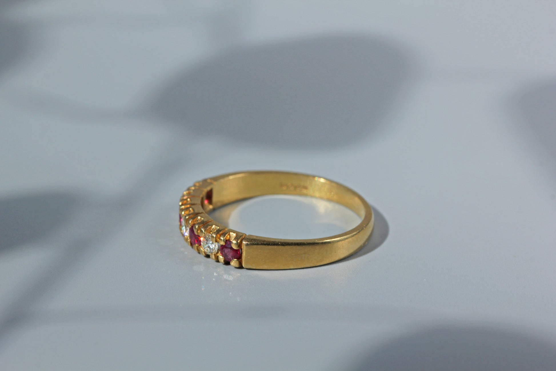 Side view of vintage 18ct gold ruby and diamond ring
