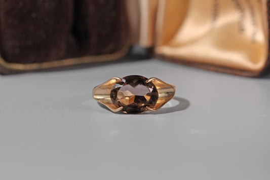 close up of vintage smoky quartz gold solitaire ring
