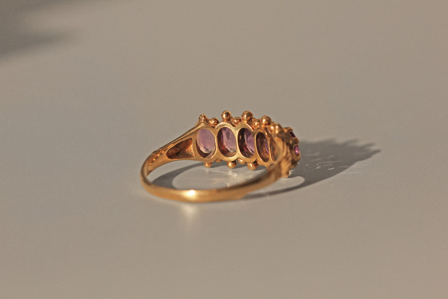 Vintage amethyst five stone ring, in 9 carat gold