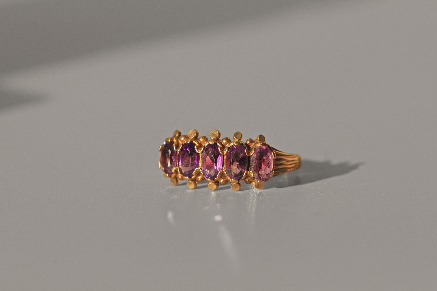 Vintage amethyst five stone ring, in 9 carat gold
