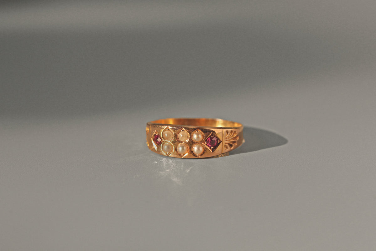 Antique Victorian ruby and seed pearl band ring in 15 carat gold