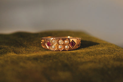 Close up of Victorian ruby and seed pearl ring face
