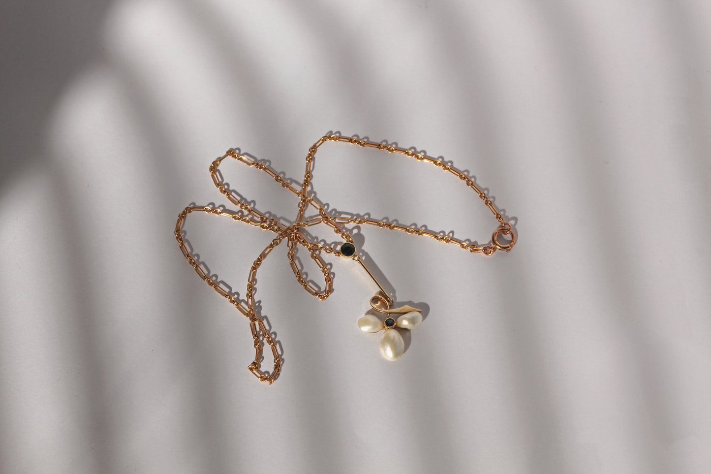 Antique pearl and sapphire ivy leaf pendant with fancy link gold chain
