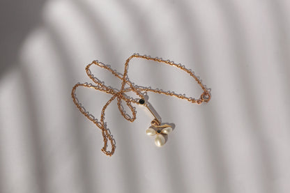 Antique pearl and sapphire ivy leaf pendant with fancy link gold chain
