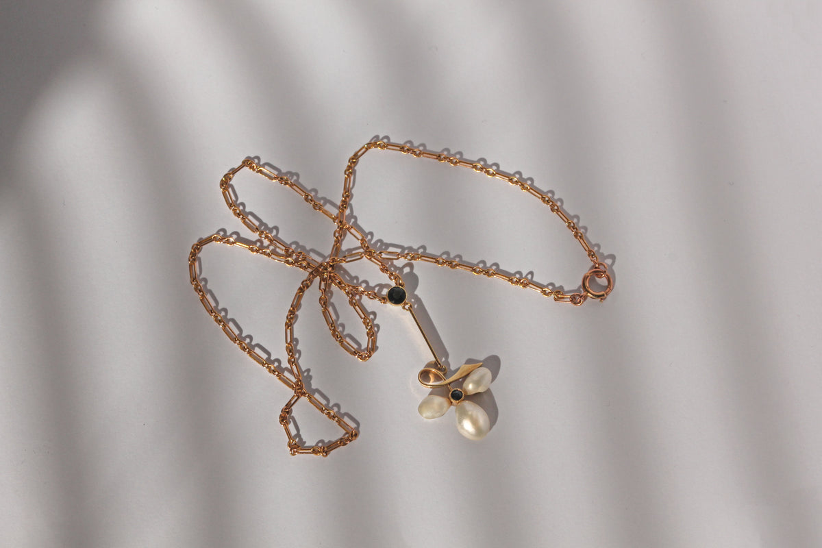 Edwardian 15ct gold necklace with baroque pearl leaf design and sapphire
