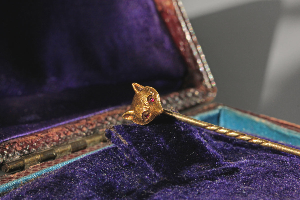 Antique Victorian fox head pin with pink topaz eyes in 9 carat gold in purple velvet old jewellery box