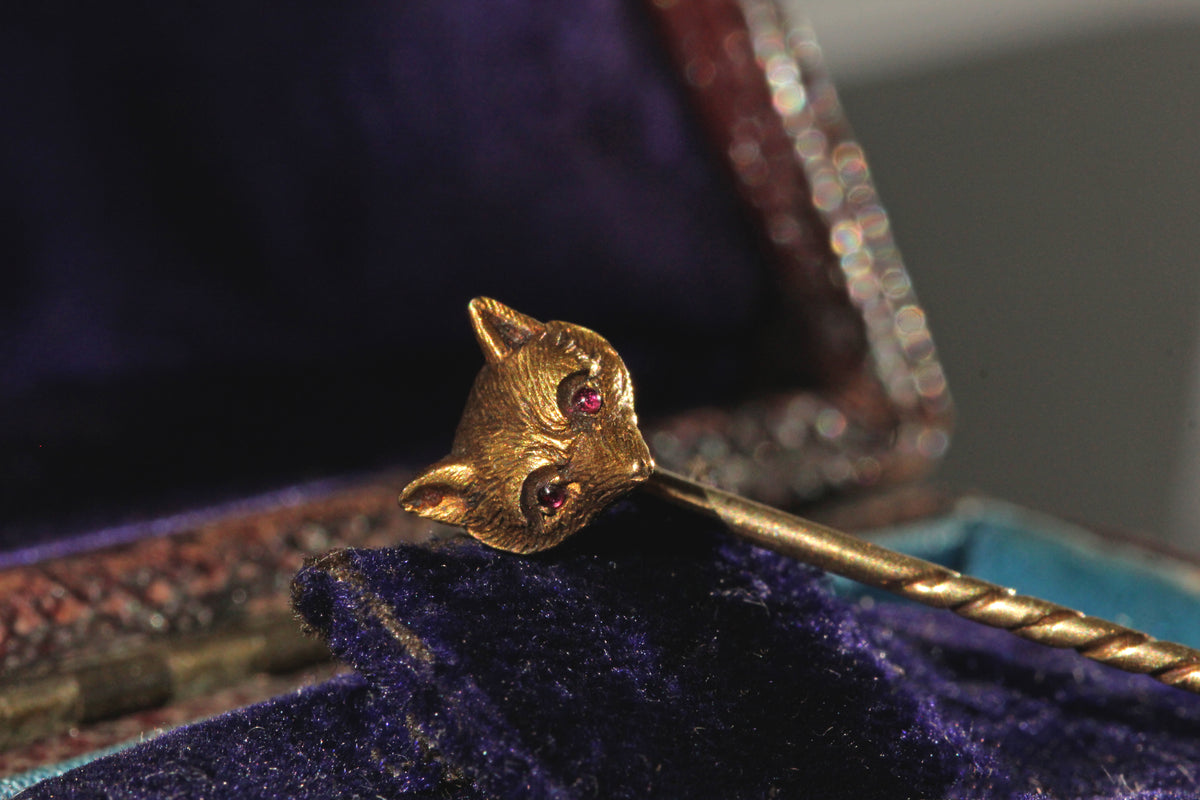 Antique gold fox head pin with ruby eyes