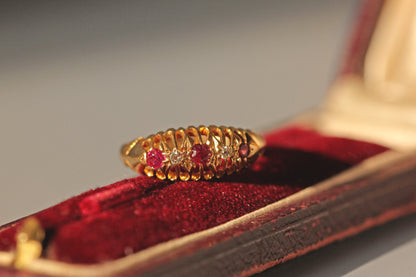 Antique old cut diamond and ruby boat ring, in 18 carat gold