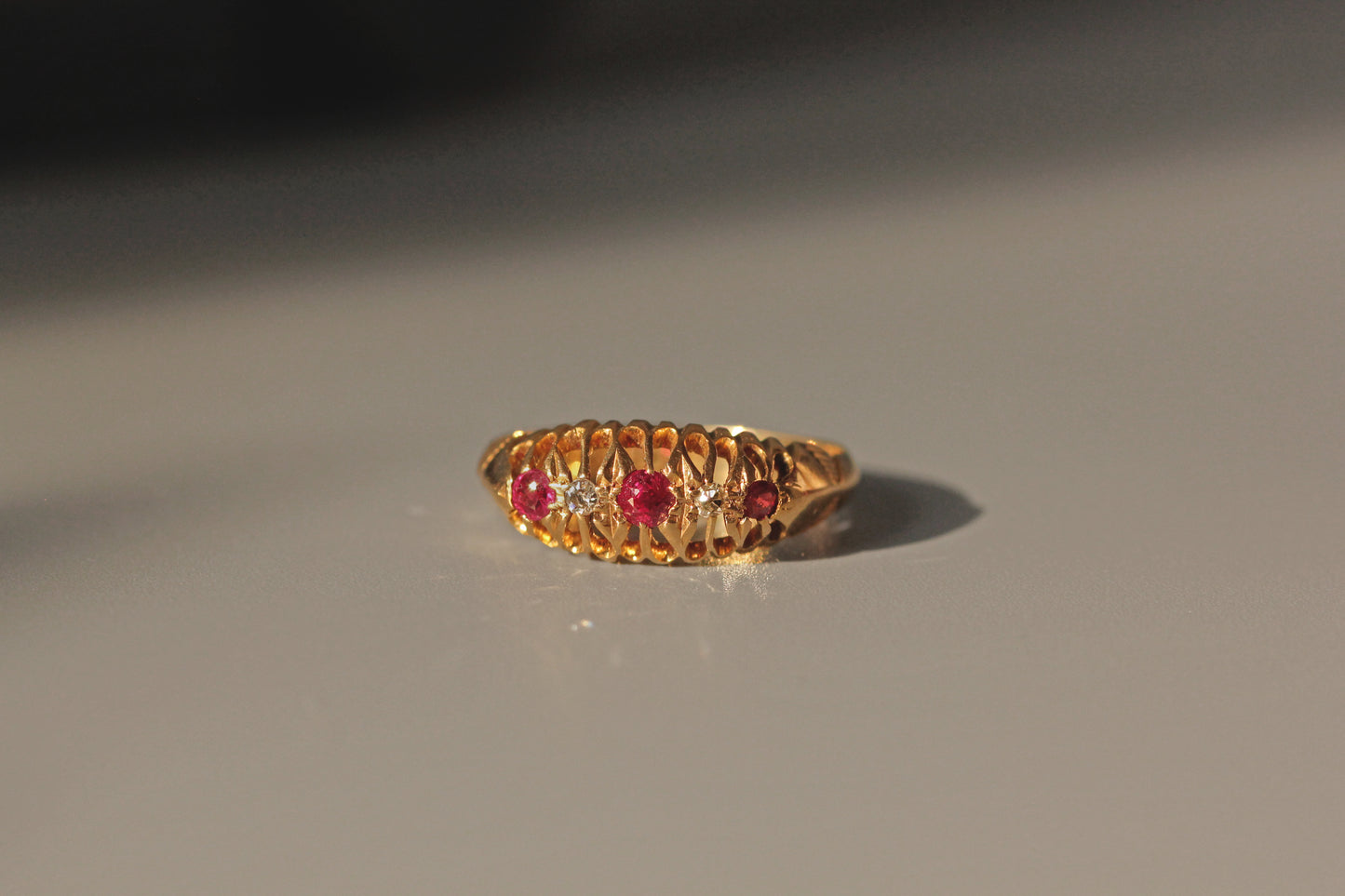 Antique old cut diamond and ruby boat ring, in 18 carat gold