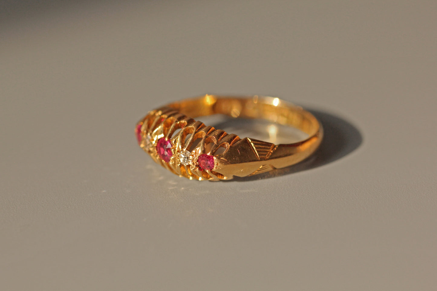 Antique old cut diamond and ruby boat ring, in 18 carat gold