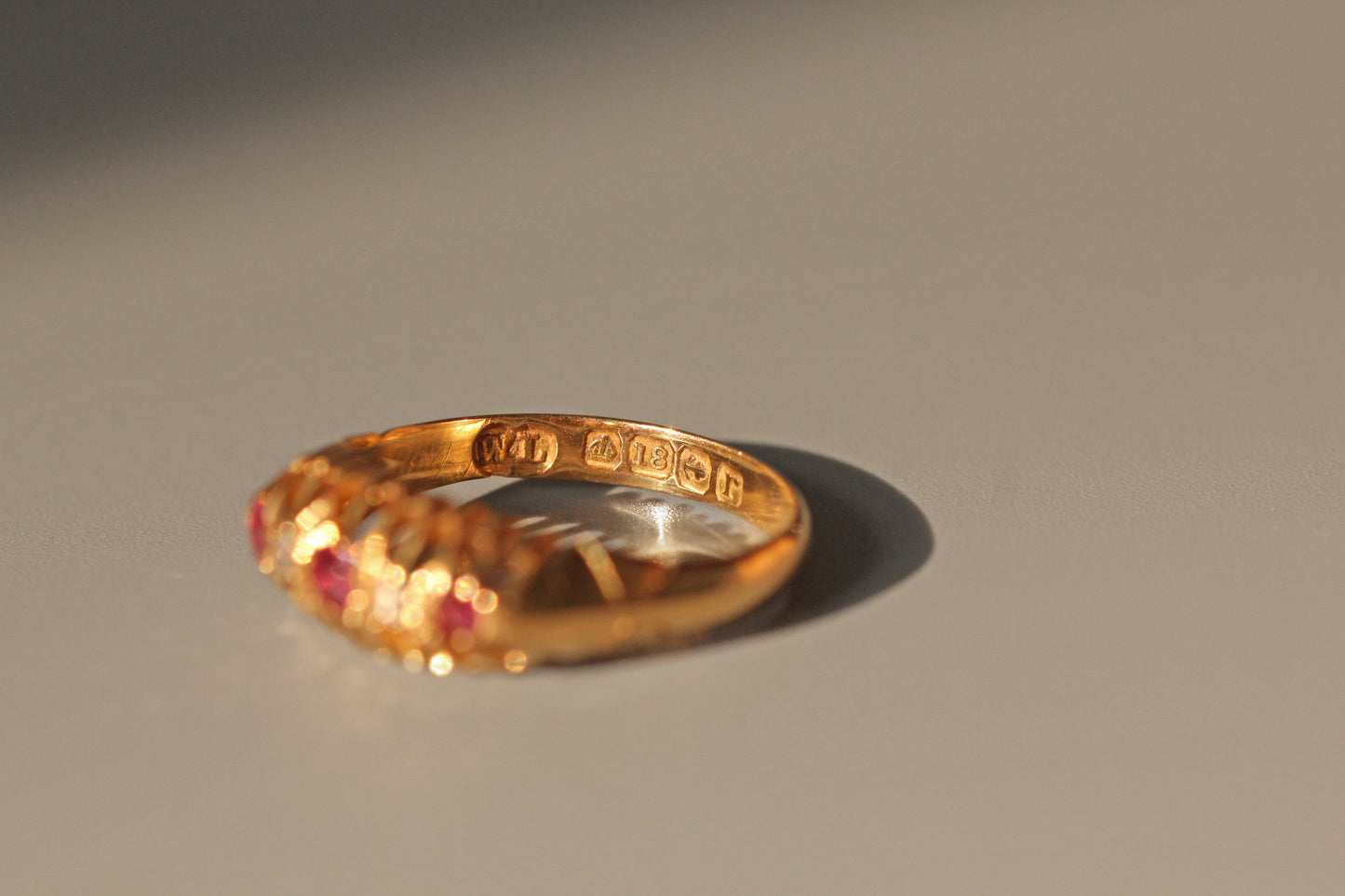 Antique old cut diamond and ruby boat ring, in 18 carat gold