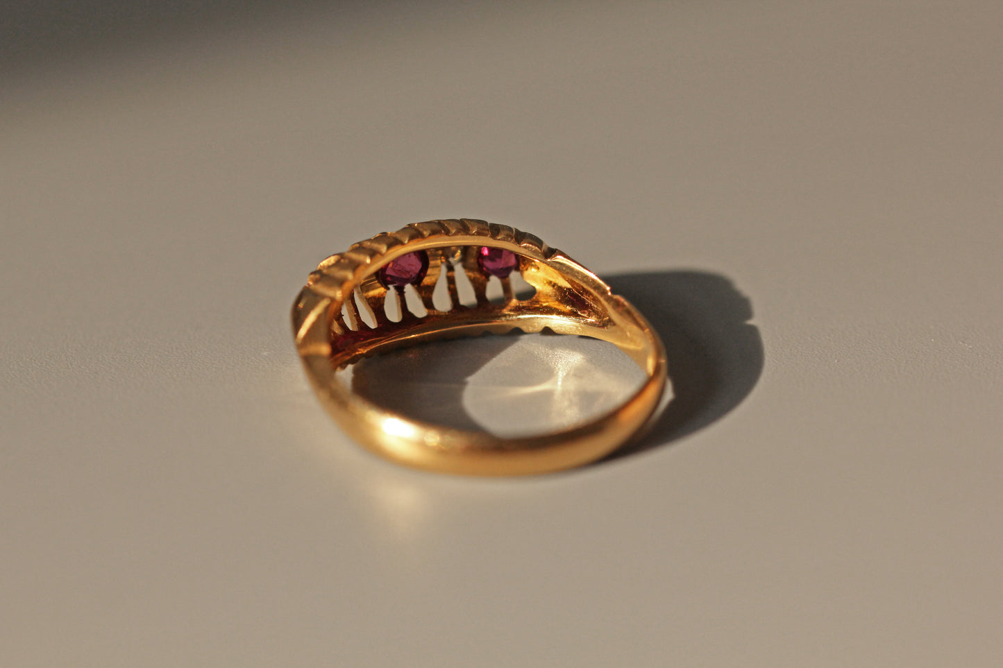Antique old cut diamond and ruby boat ring, in 18 carat gold