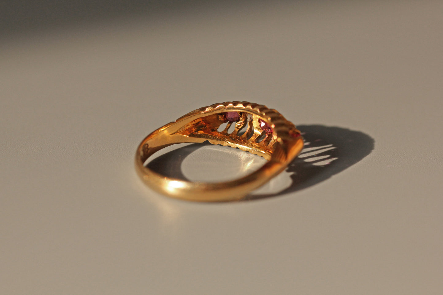 Antique old cut diamond and ruby boat ring, in 18 carat gold