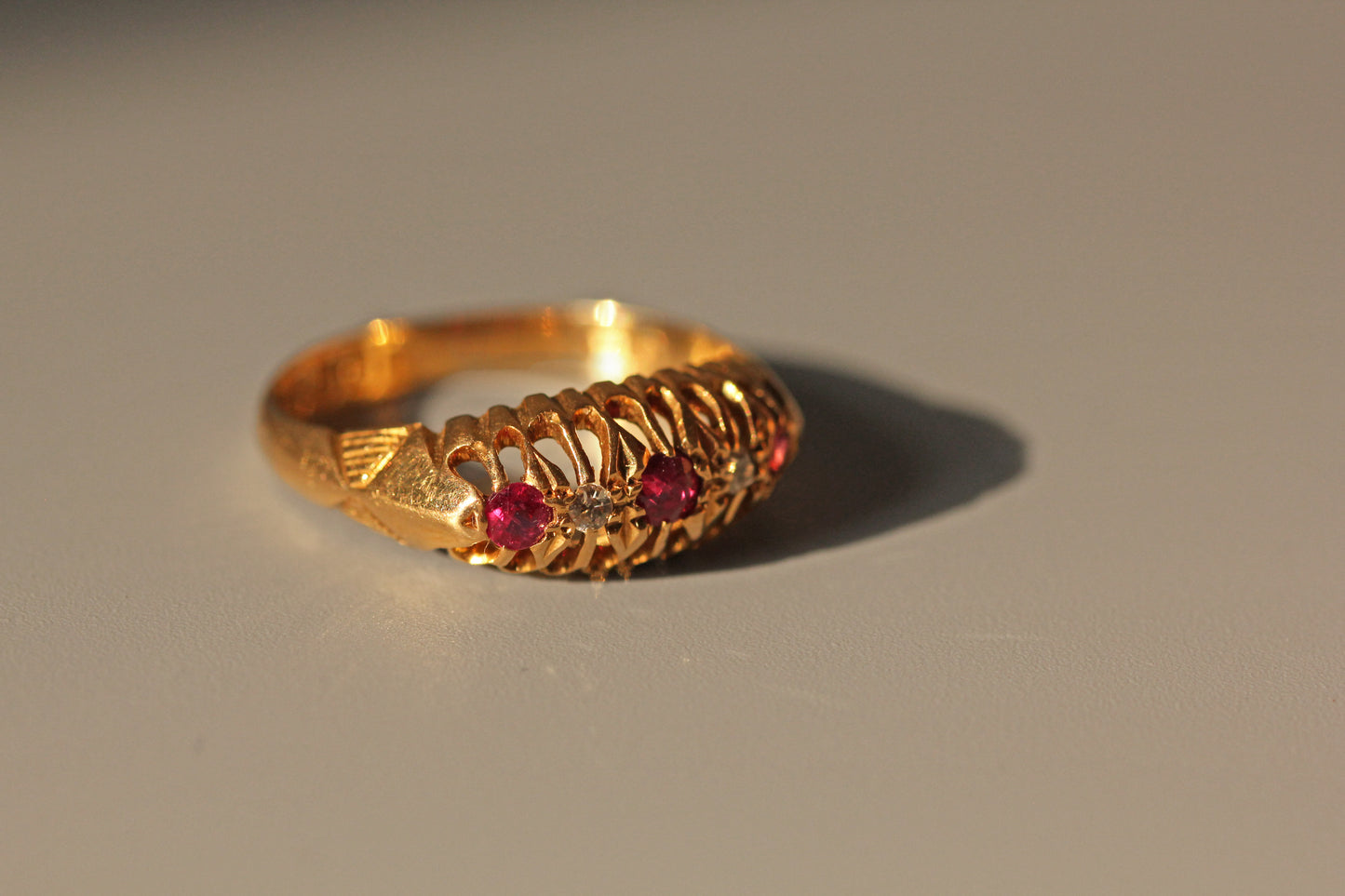 Antique old cut diamond and ruby boat ring, in 18 carat gold