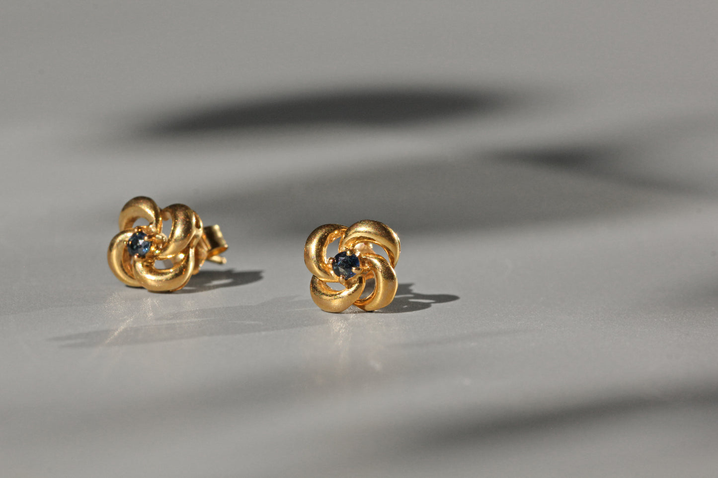 Vintage sapphire love knot stud earrings, in 9 carat gold