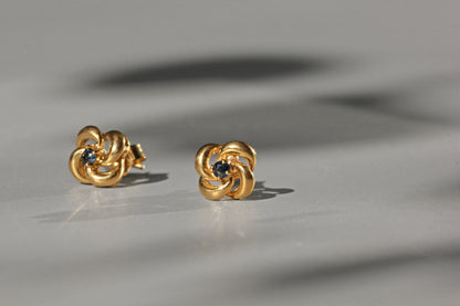Vintage sapphire love knot stud earrings, in 9 carat gold