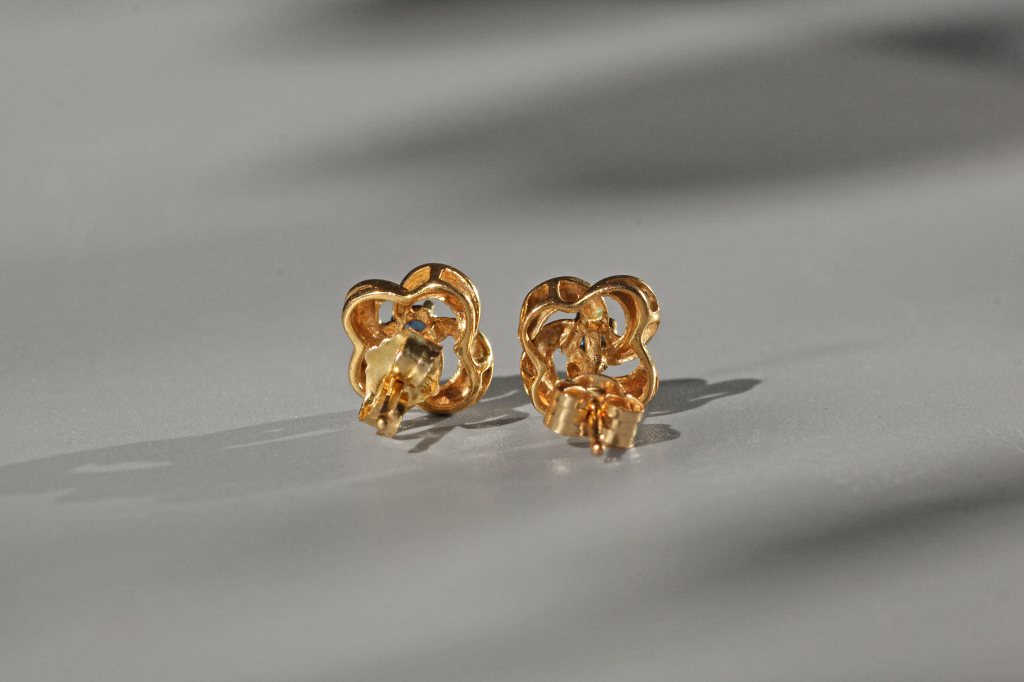 Vintage sapphire love knot stud earrings, in 9 carat gold