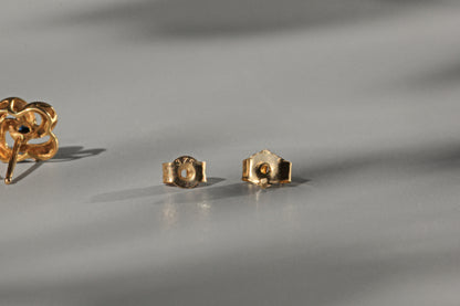 Vintage sapphire love knot stud earrings, in 9 carat gold