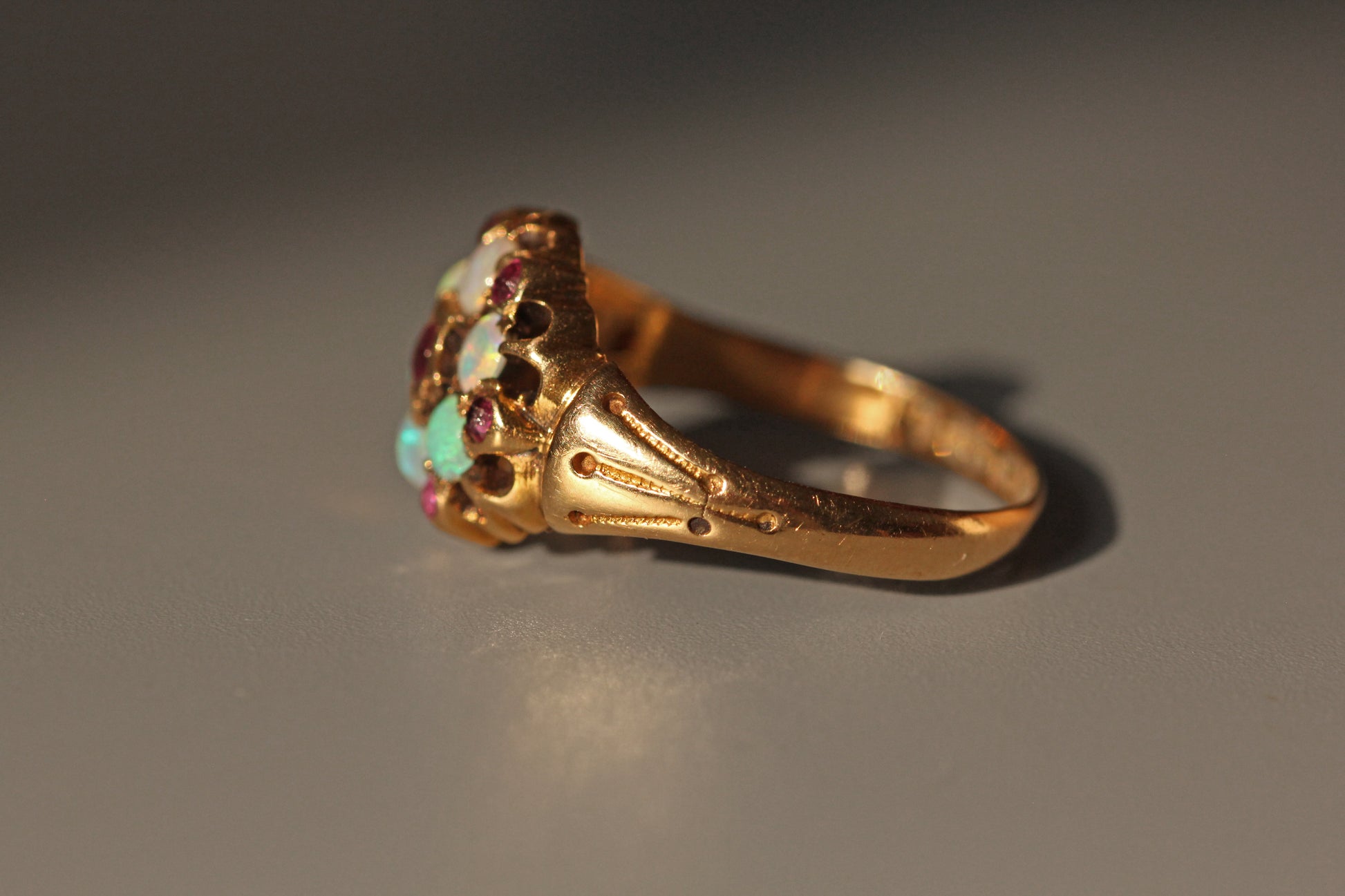 Antique Victorian opal and amethyst celestial cluster ring in 18ct gold side profile