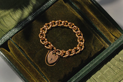 Antique heart padlock bracelet with safety chain in 9 carat gold
