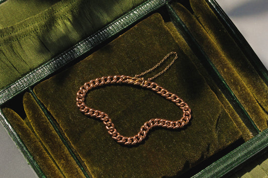 Antique 9 carat gold curb link bracelet with concealed patent bolt snap clasp
