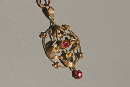 Antique gold lavaliere pendant with openwork and beaded detail
