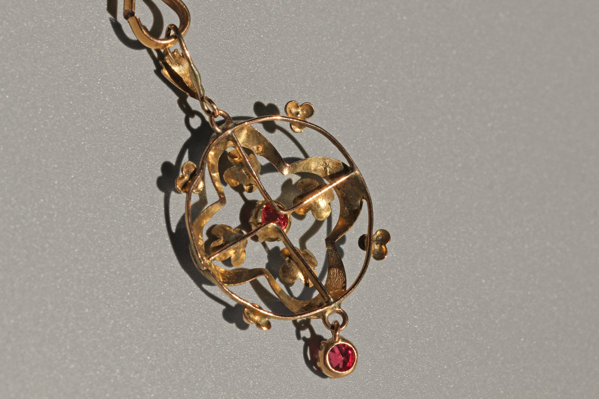 back view of Art Nouveau ruby paste pendant with hanging drop