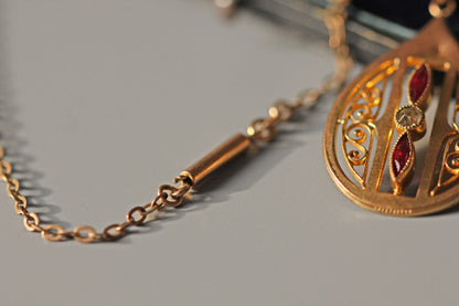 Antique rose gold lavaliere style pendant with Victorian paste stones
