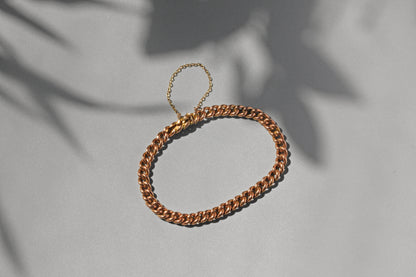 Victorian antique curb link bracelet in warm rosy 9ct gold with safety chain

