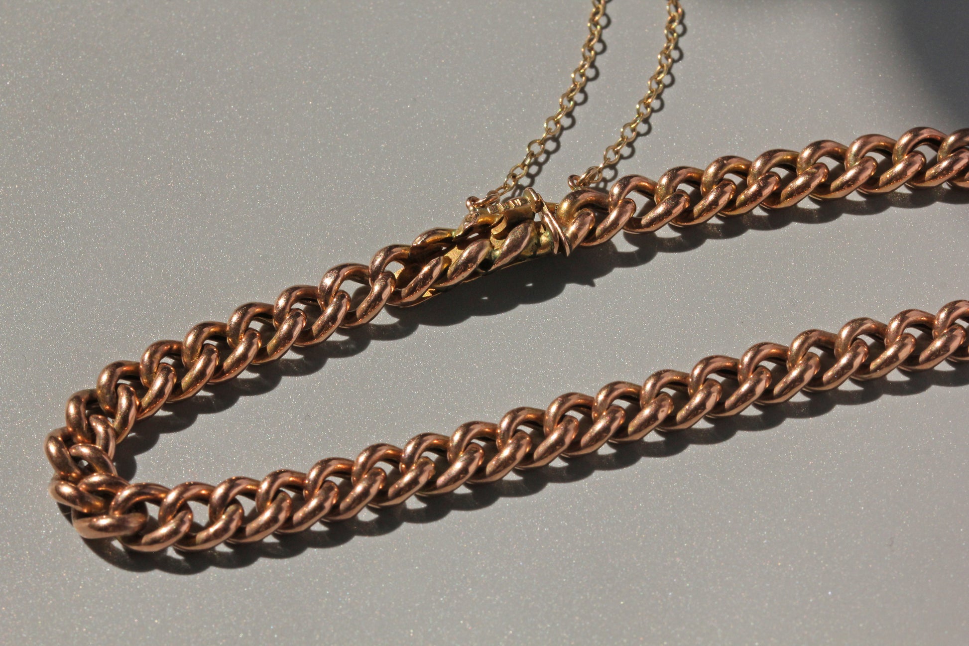 Victorian curb link bracelet with patent bolt snap fastening in antique gold
