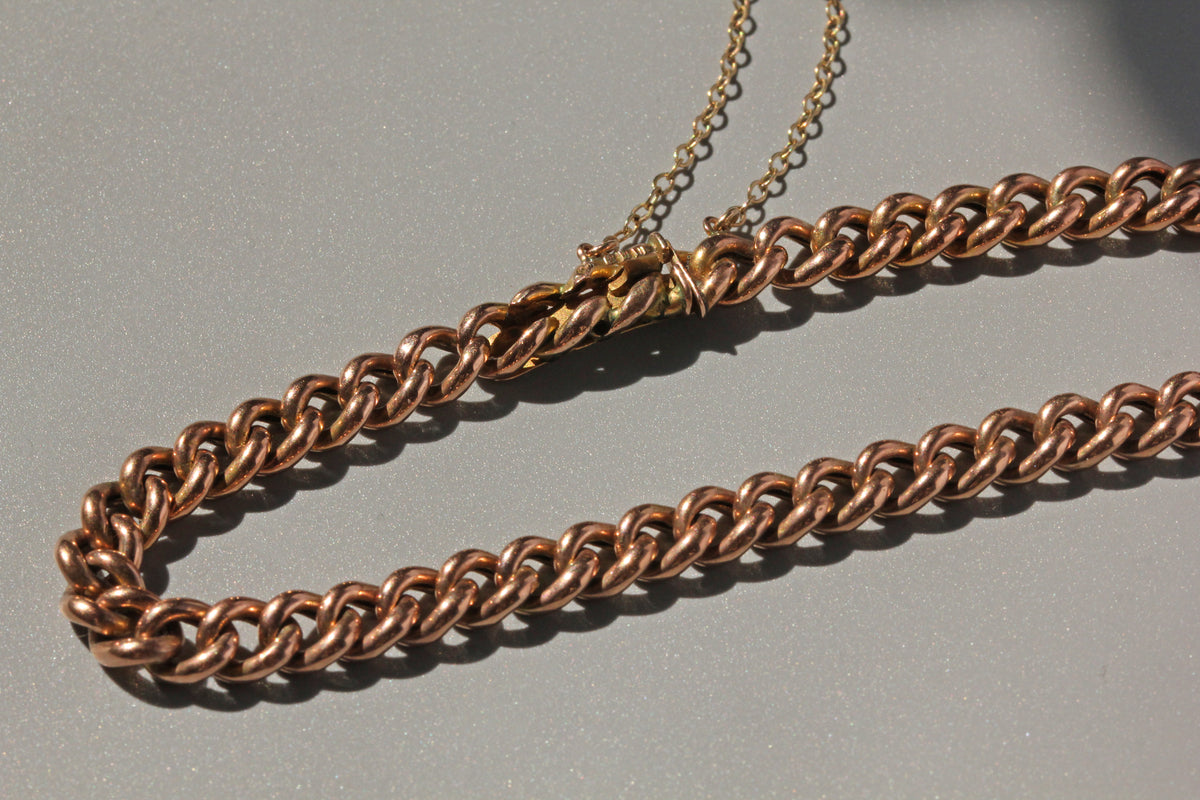 Victorian curb link bracelet with patent bolt snap fastening in antique gold
