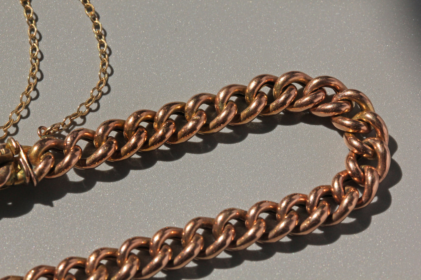 Detailed view of antique gold curb bracelet clasp marked Patent Bolt Snap and H.G&S
