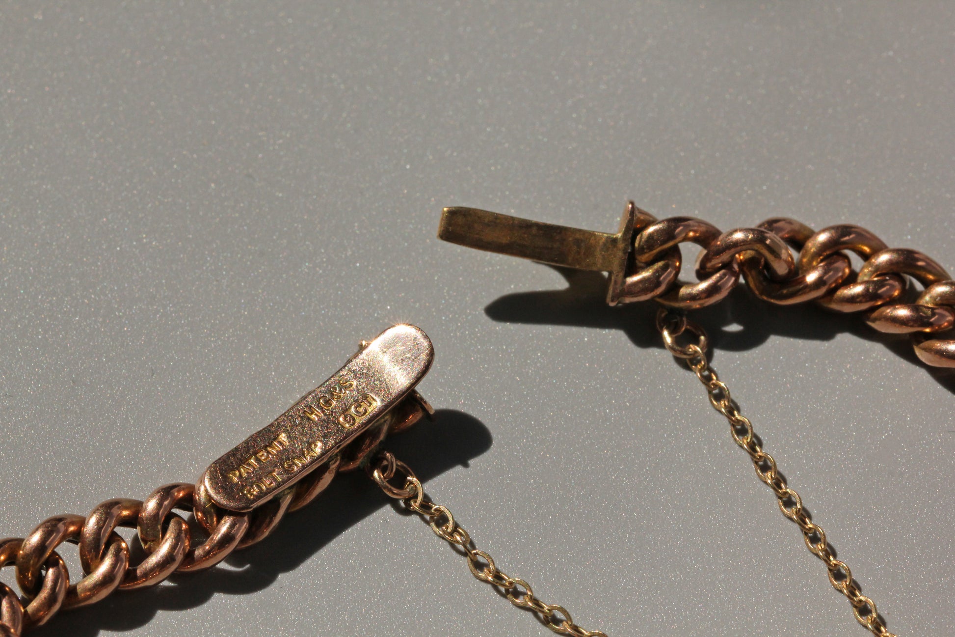 Elegant antique 9ct gold curb bracelet with seamless hidden clasp design