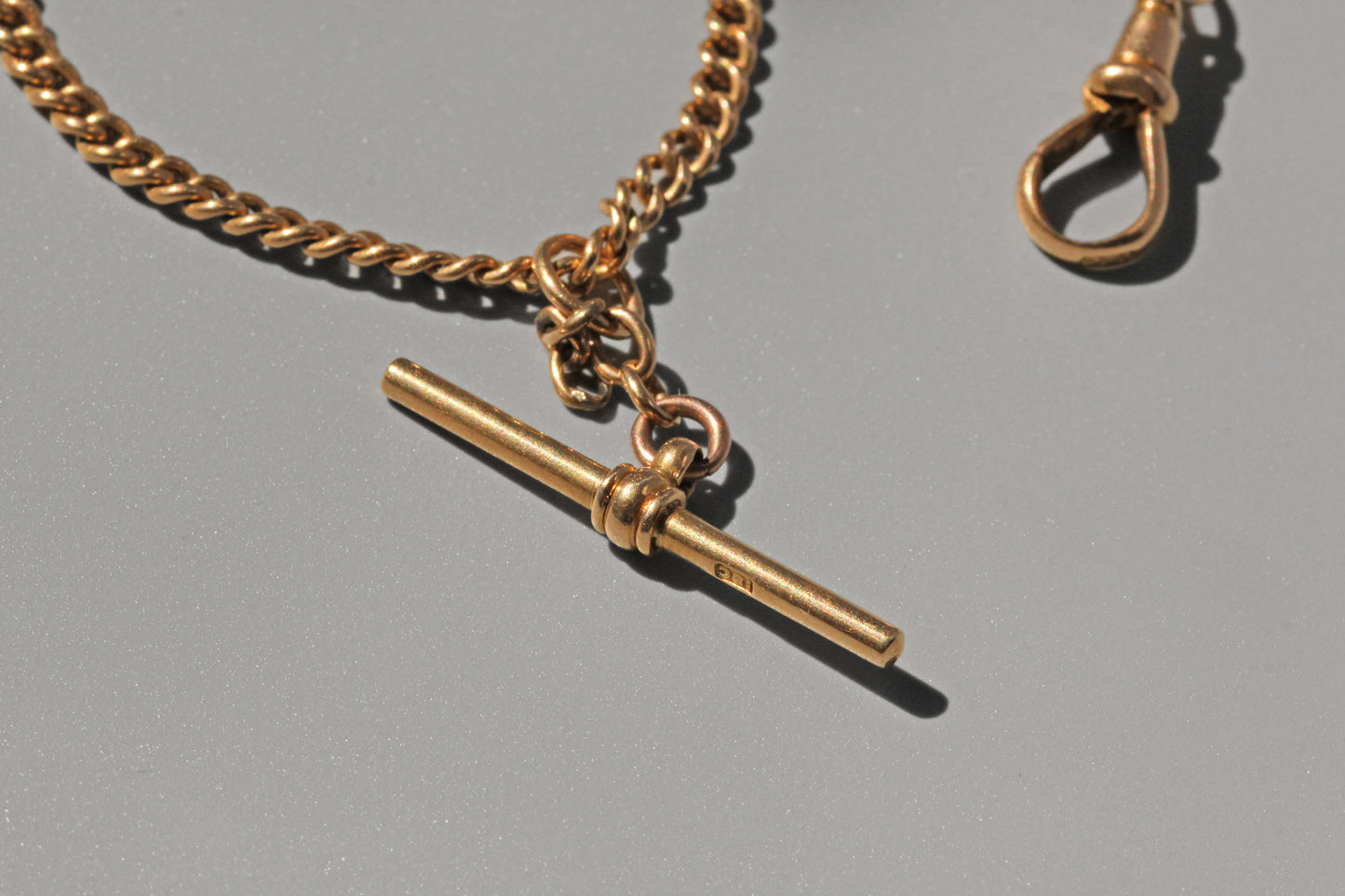 Antique curb link albert chain, in 18 carat gold
